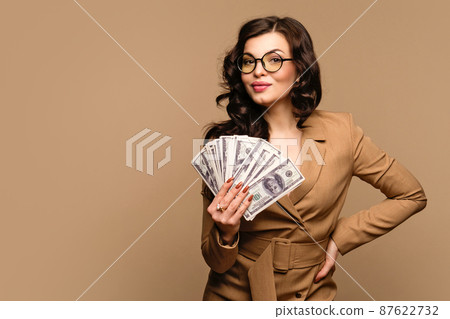 woman showing fan of cash money 87622732