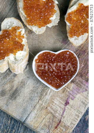 natural red salmon caviar with baguette and butter natural red salmon caviar with baguette and butter 87623753