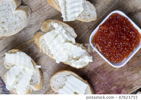 red salmon or trout caviar with white baguette and butter red salmon or trout caviar with white baguette and butter 87623755