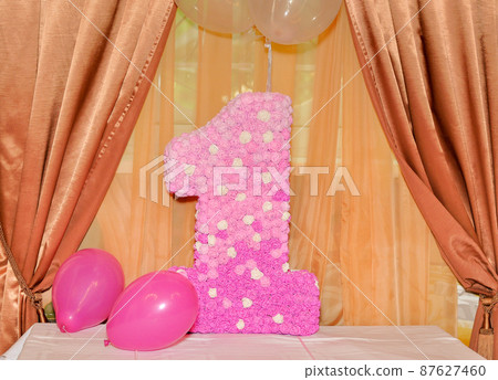 decorated number 1 and balloons. birthday of a one-year-old child 87627460