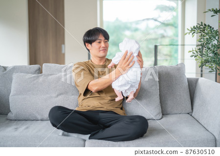 A man who takes care of a baby (smile) A man who takes care of a baby (smile) 87630510