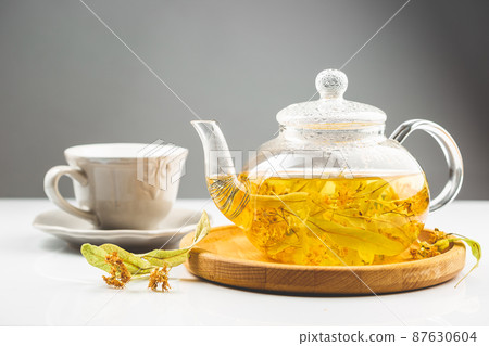 Healthy linden or tilia flower tea in the tea pot 87630604