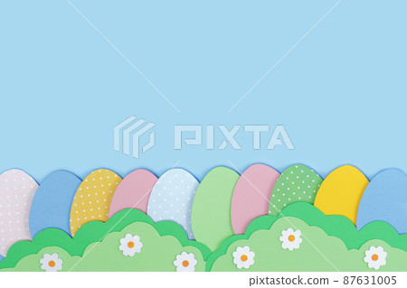 Happy Easter. Painted Easter eggs cutting out paper and grass made of green paper on blue background. Happy Easter. Painted Easter eggs cutting out paper and grass made of green paper on blue background. 87631005