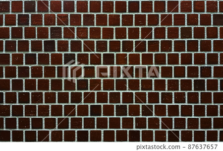 Horizontal background image of dark brown square brick tile wall Horizontal background image of dark brown square brick tile wall 87637657