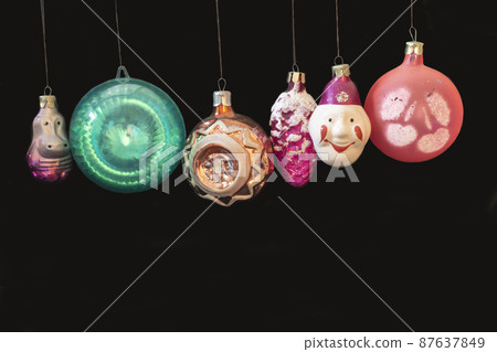 Old toys for fir tree on black background 87637849