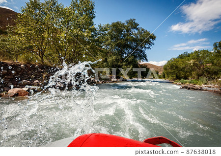 Landscape from a rafting inflatable boat on a mountain river, Foam and spray around Landscape from a rafting inflatable boat on a mountain river, Foam and spray around 87638018
