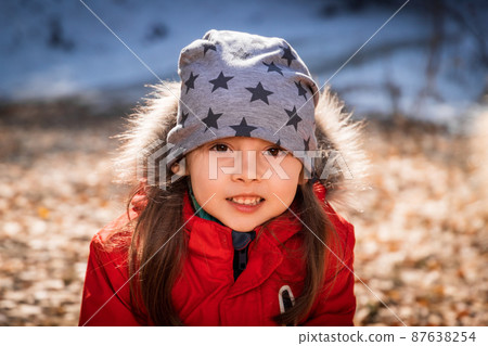Outdoor portrait of 5 y.o. girl in autumn sunny day 87638254