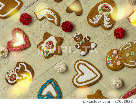 Many Christmas cookies on white wooden table Many Christmas cookies on white wooden table 87638928