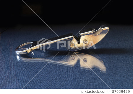 Sharpening the knife from steels rests upon turn blue table with reflection Sharpening the knife from steels rests upon turn blue table with reflection 87639439