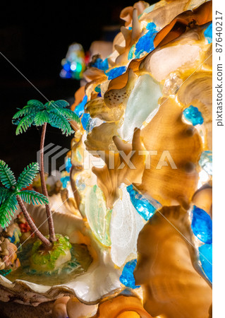 Shining seashells and palm tree objects Shining seashells and palm tree objects 87640217
