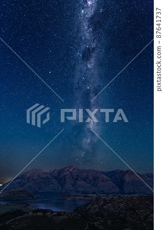 Roys Peak, Lake Wanaka and the Starry Sky from Rocky Hill in the Diamond Lake Protected Area of New Zealand 87641737