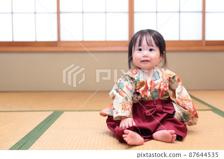 A baby wearing a hakama in a Japanese-style room 87644535