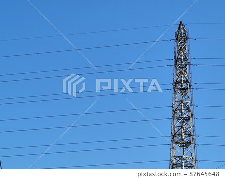 Transmission lines supported by the blue sky and towers Transmission lines supported by the blue sky and towers 87645648