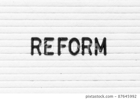 Black color letter in word reform on white felt board background 87645992