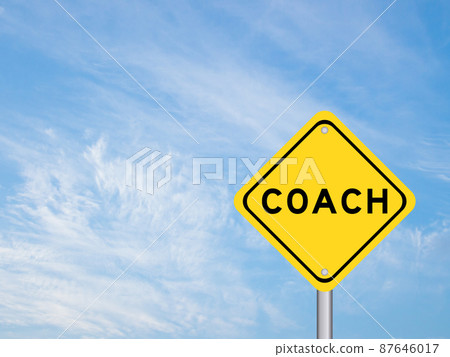Yellow transportation sign with word coach on blue color sky background Yellow transportation sign with word coach on blue color sky background 87646017