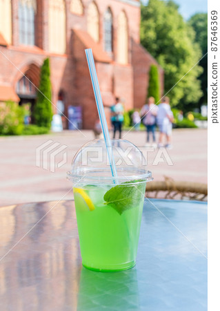 Green alcohol free mojito in plastic cup. Green alcohol free mojito in plastic cup. 87646369