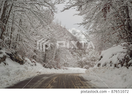 Winter road in the snow. Winter road trip 87651072
