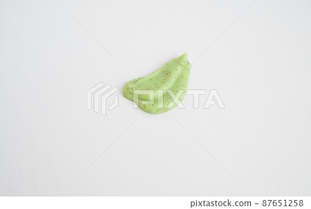 A sample of a natural green scrub on a white background. 87651258
