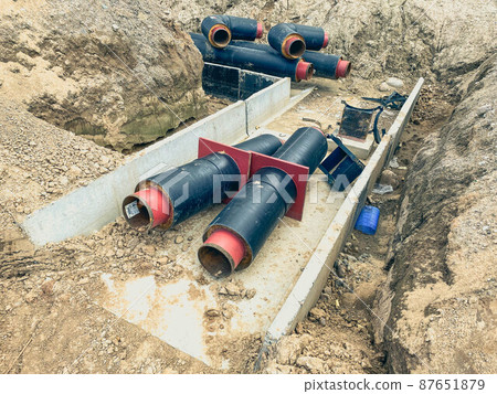 construction of a new neighborhood. laying communications, pipes on the ground for sewerage. wide pipe for water and waste products 87651879