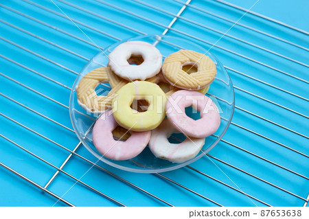 Cookie shapes donut on metal cooling rack 87653638