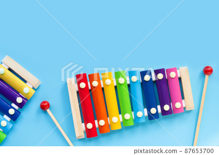 Colorful xylophone on blue background. 87653700