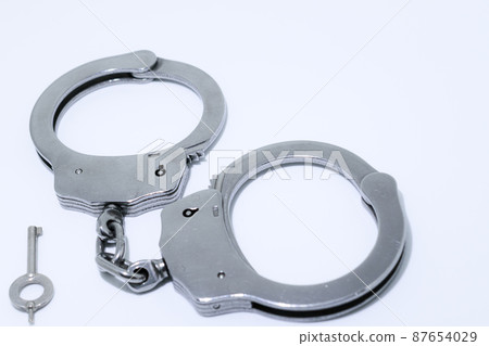 Silver handcuffs (police, interrogation, arrest image) 87654029