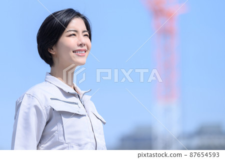 Japanese woman smiling in work clothes Japanese woman smiling in work clothes 87654593
