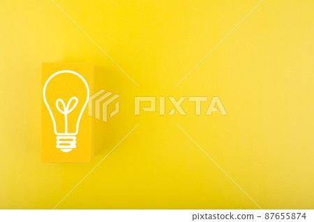 Creativity, innovation and idea concept. Light bulb drawn on yellow rectangle on yellow background with copy space Creativity, innovation and idea concept. Light bulb drawn on yellow rectangle on yellow background with copy space 87655874