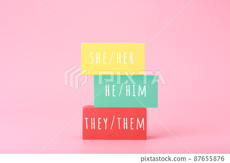 Correct pronouns for different genders hand written on multicolored rectangles against bright pink background Correct pronouns for different genders hand written on multicolored rectangles against bright pink background 87655876