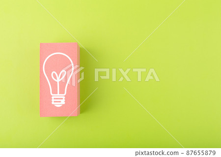 Creativity, innovation and idea concept. Light bulb drawn on pink rectangle on bright green background with copy space 87655879