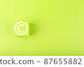 Minimal copyright and intellectual property protection concept on bright green background with copy space 87655882