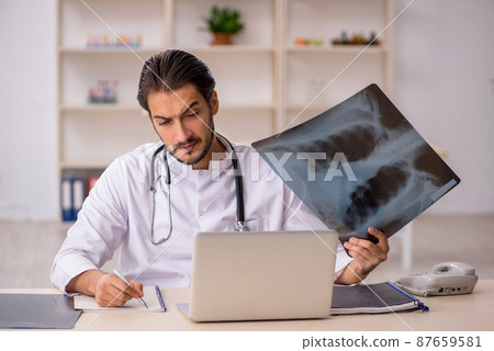 Young male doctor radiologist working in the clinic 87659581