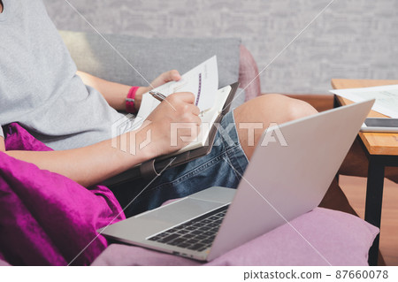 A man in casual wear is working at home office. A man in casual wear is working at home office. 87660078