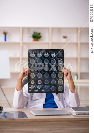 Young male doctor radiologist working in the clinic 87661018