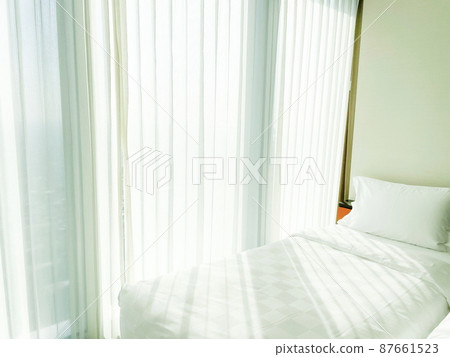 Bedroom with large windows 87661523