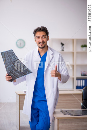 Young male doctor radiologist working in the clinic 87661691