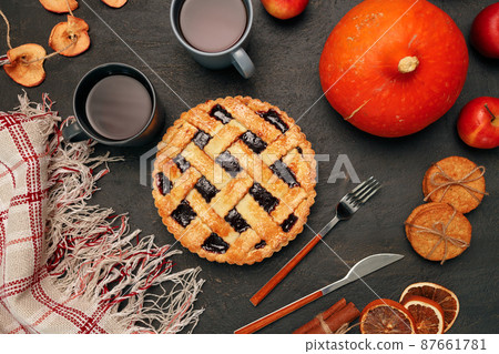 Thanksgiving pie and pumpkin on black background 87661781