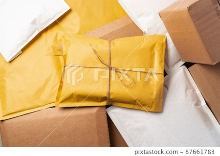 Lot of yellow paper postal envelopes. Top view. Lot of yellow paper postal envelopes. Top view. 87661783