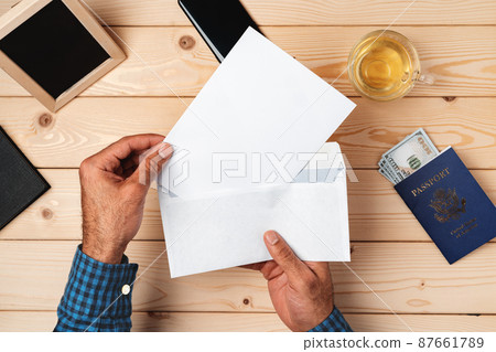 Passport with letter on desk background 87661789