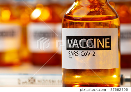 Sars-cov-2 vaccine vial bottles on white table Sars-cov-2 vaccine vial bottles on white table 87662506