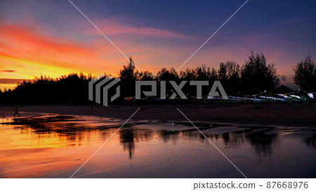 restaurant near Cha Am beach with twilight sky at dusk restaurant near Cha Am beach with twilight sky at dusk 87668976