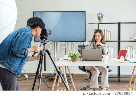 Videographer record footage of young female blogger Videographer record footage of young female blogger 87668994