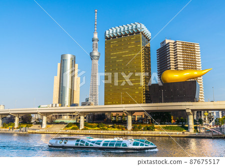 Tokyo cityscape of Japan overlooking the water bus "Emeraldas" and the Sumida River = March 11 87675517