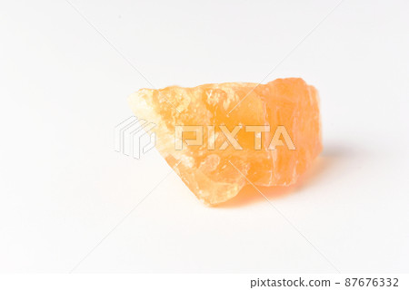 corundum stone on a white background. yellow. corundum stone on a white background. yellow. 87676332