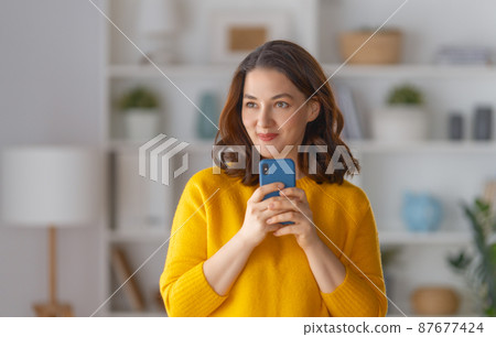 woman is using phone 87677424