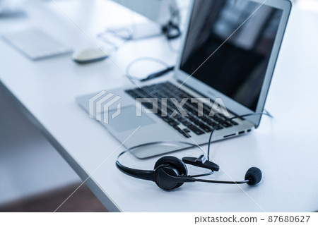 Headset and customer support equipment at call center ready for actively service Headset and customer support equipment at call center ready for actively service 87680627