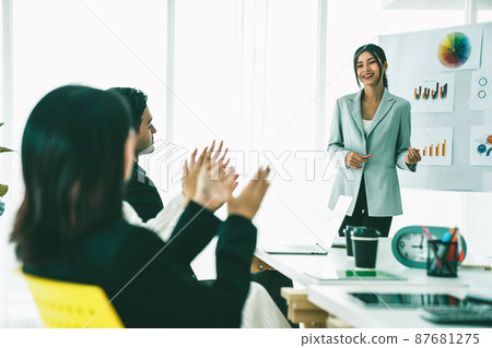 Businesswoman proficiently present work project receive celebrations from team Businesswoman proficiently present work project receive celebrations from team 87681275