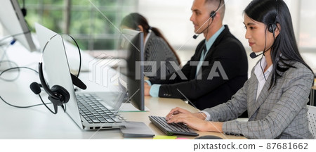 Business people wearing headset working in office broaden view Business people wearing headset working in office broaden view 87681662