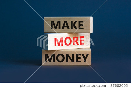 Make more money symbol. Concept words Make more money on blocks on beautiful grey table grey background. Business, make more money concept. Copy space. Make more money symbol. Concept words Make more money on blocks on beautiful grey table grey background. Business, make more money concept. Copy space. 87682003