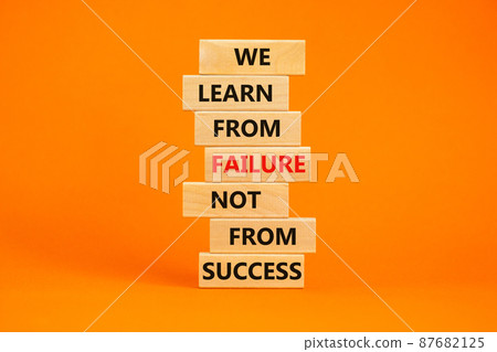 Failure or success symbol. Wooden blocks with words We learn from failure not from success. Beautiful orange background, copy space. Business, learn from failure or success concept. Failure or success symbol. Wooden blocks with words We learn from failure not from success. Beautiful orange background, copy space. Business, learn from failure or success concept. 87682125